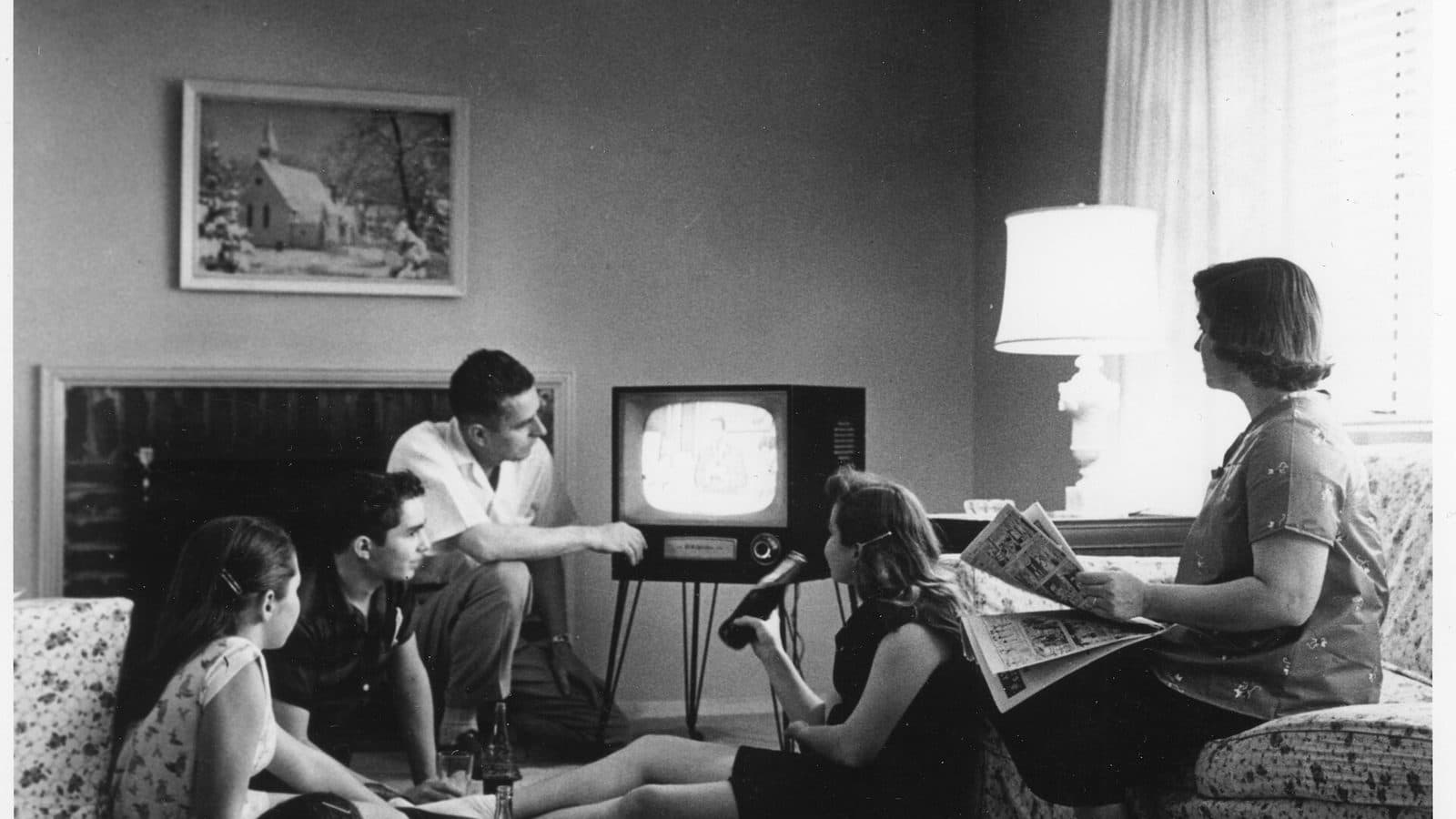 A family gathered around the television in 1958