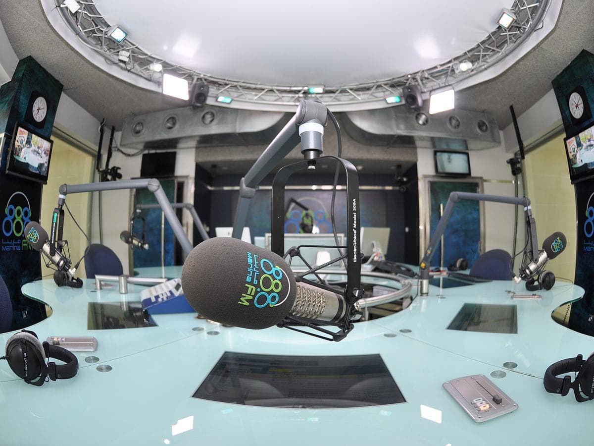 A professional radio studio with broadcast microphones